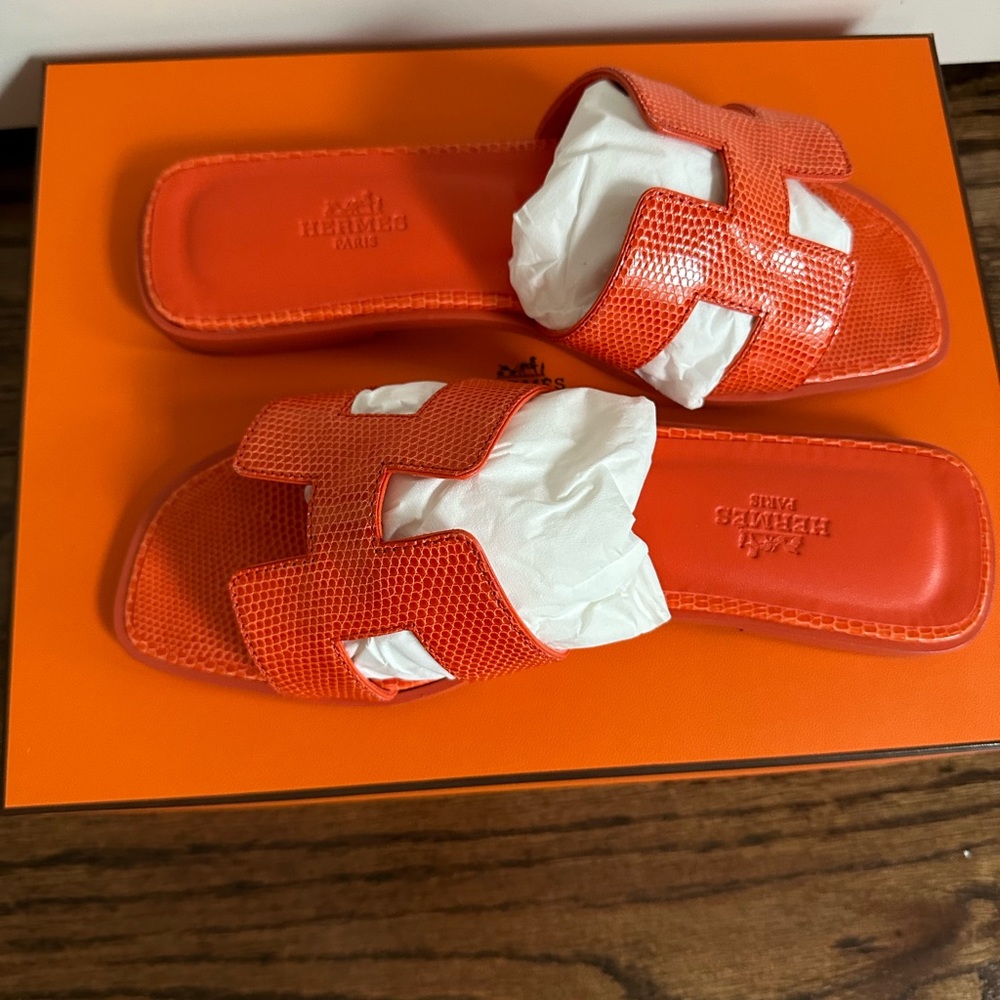 Brand new in box Hermes orange Oran sandals in lizard material.